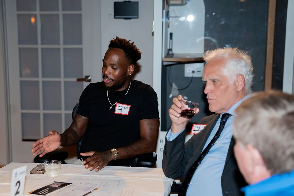 Networking session with a young professional in a suit over wine